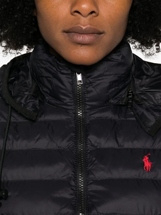 Close up of the black jacket, showing texture of the polyester fabric