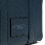 Close up of the blue bag, showing texture of the leather fabric