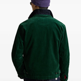 Green windbreaker worn by a person, showing the windbreaker's fit