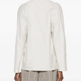 white shirts worn by a person, showing the shirts fit
