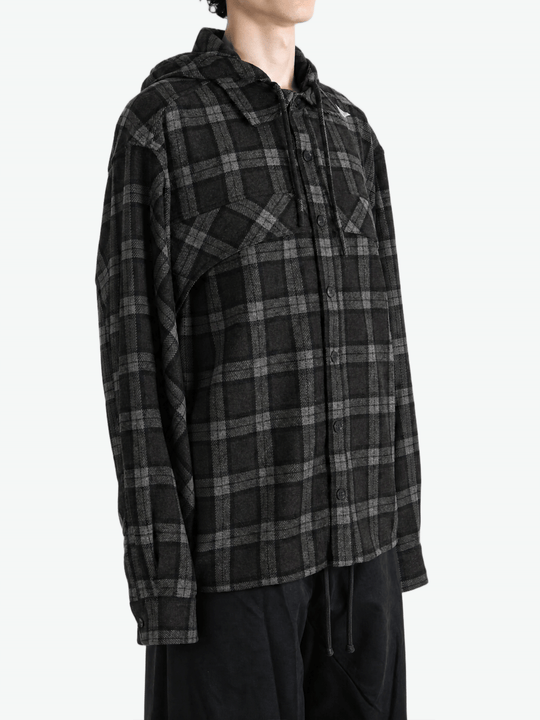 Black shirt worn by a person, showing the shirt fit