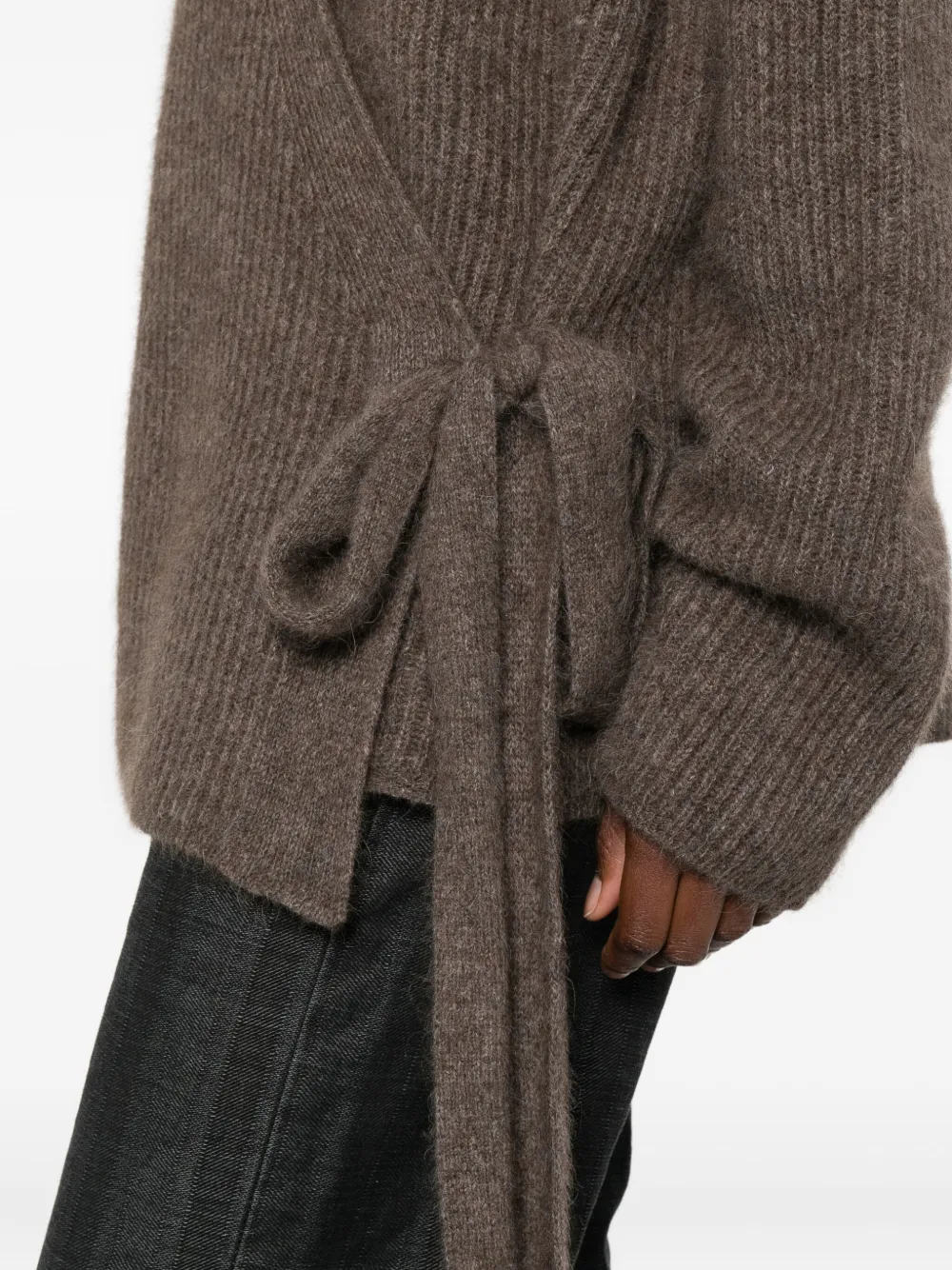 Close up of brown shirts, showing texture of the racoon fur fabric