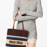 Brown bag carried by a person, showing the bag fit