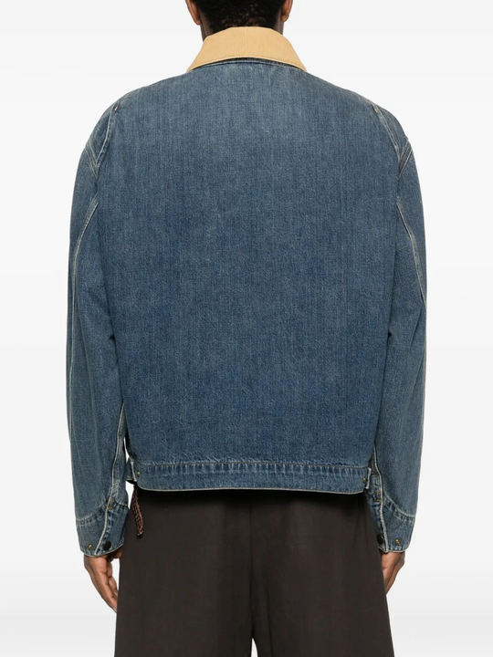 Blue jackets-coats, worn by a person, showing the jackets-coats fit