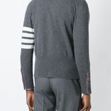 Grey knitwear worn by a person, showing the knitwear’s fit