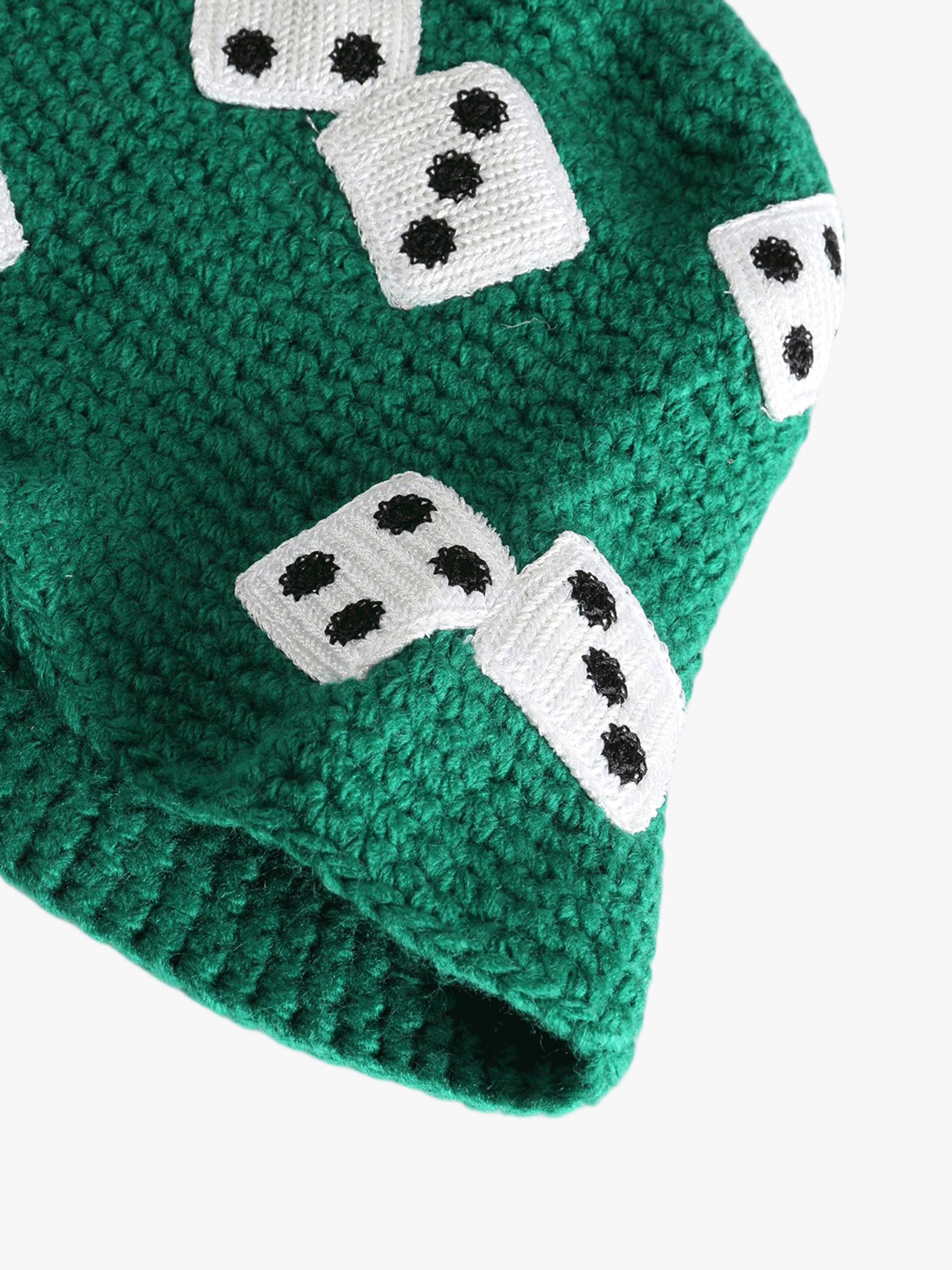 Close up of green hat,showing texture of the knit acrylic fabric