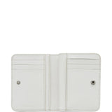 Close up of white wallet, showing texture of the split cow leather and polyurethane fabric