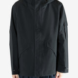 Black jacket worn by a person, showing the jacket's fit