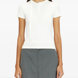 White top worn by a person, showing the top's fit