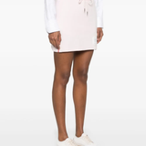 Pink skirt worn by a person, showing the skirt's fit