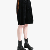 Black shorts worn by a person, showingt he short's fit