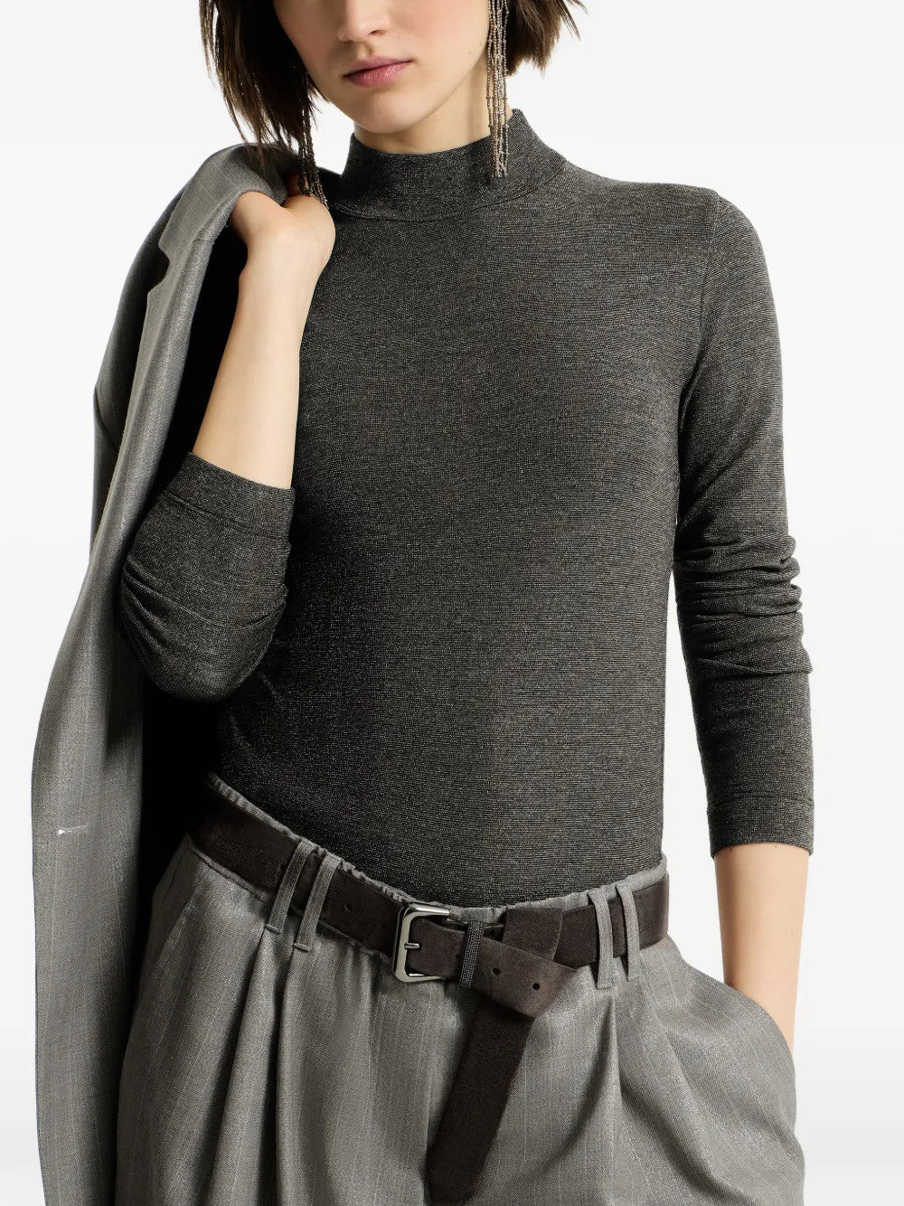Grey knitwear worn by a person, showing the knitwear fit