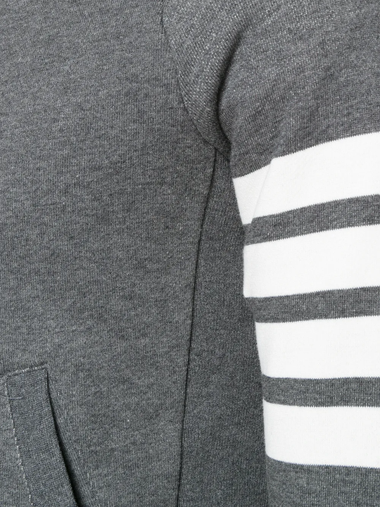 Close up of the grey hoodie, showing texture of the cotton fabric