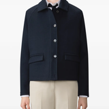 Navy jacket worn by a person, showing the jacket fit