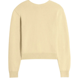 Tan knitwear, back view