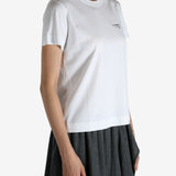 White t-shirt worn by a person, showing the shirt's fit