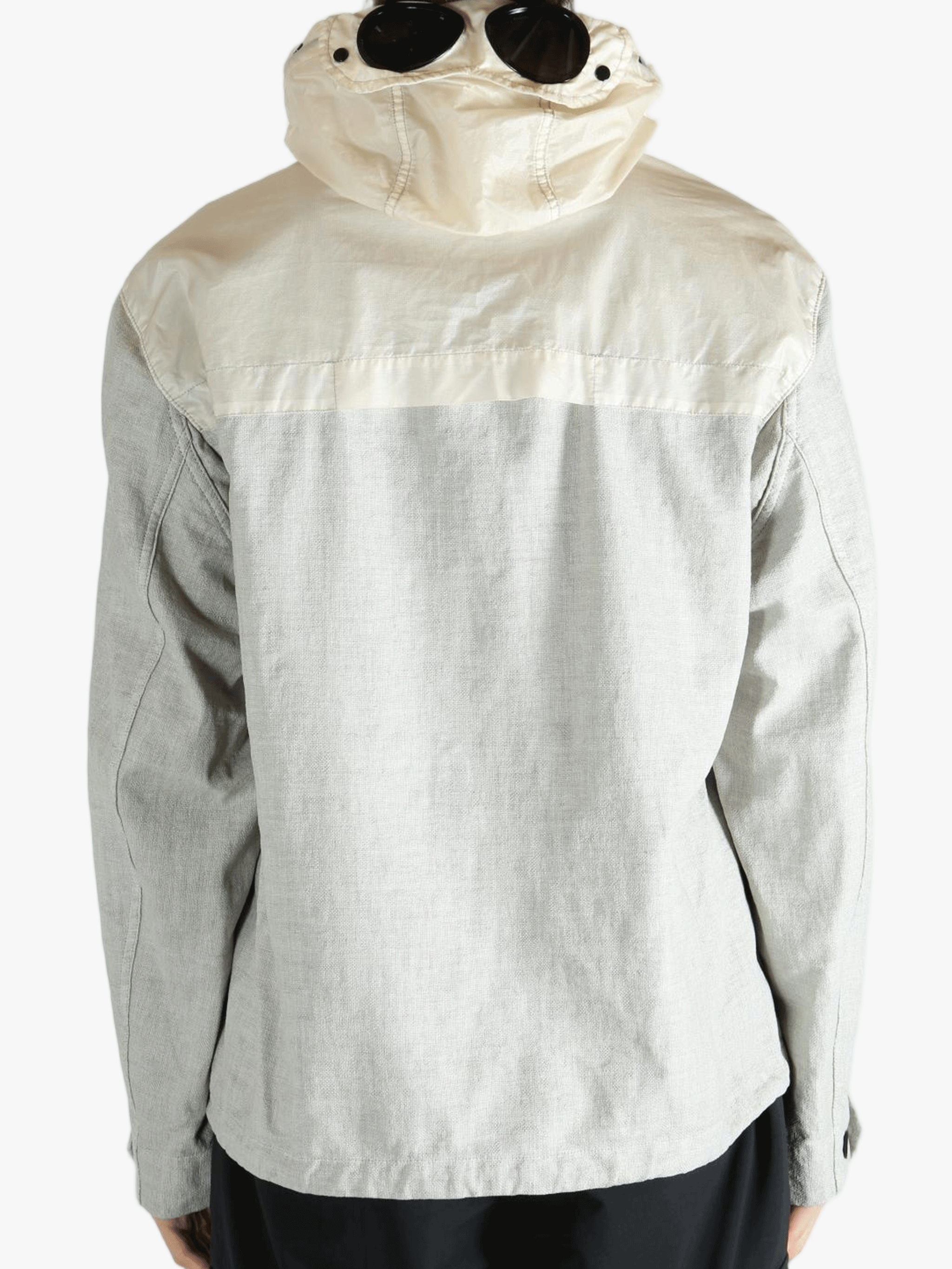 Light gray jacket worn by a person, showing the jacket fit