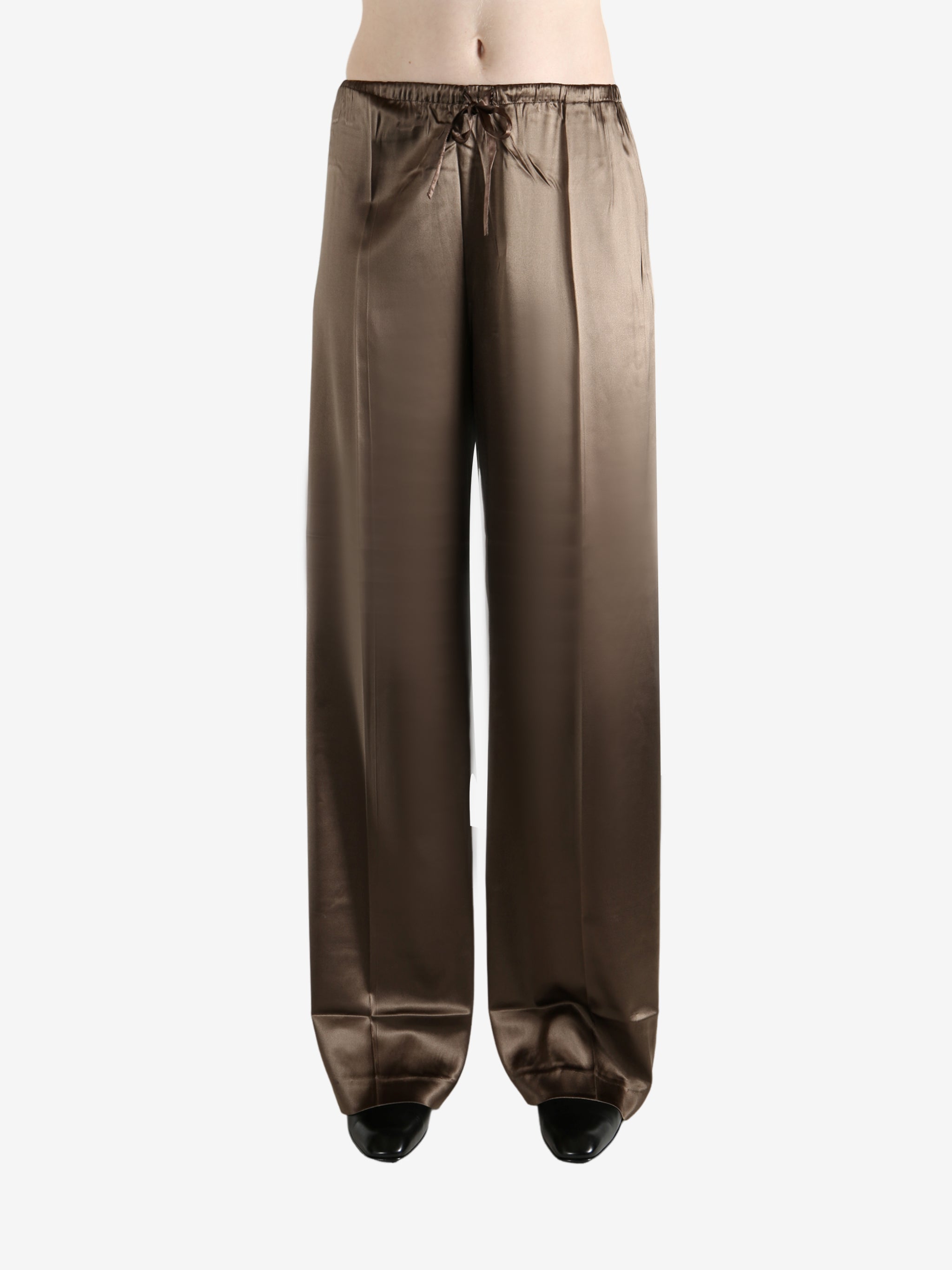 Brown pants worn by a person, showing the pants's fit