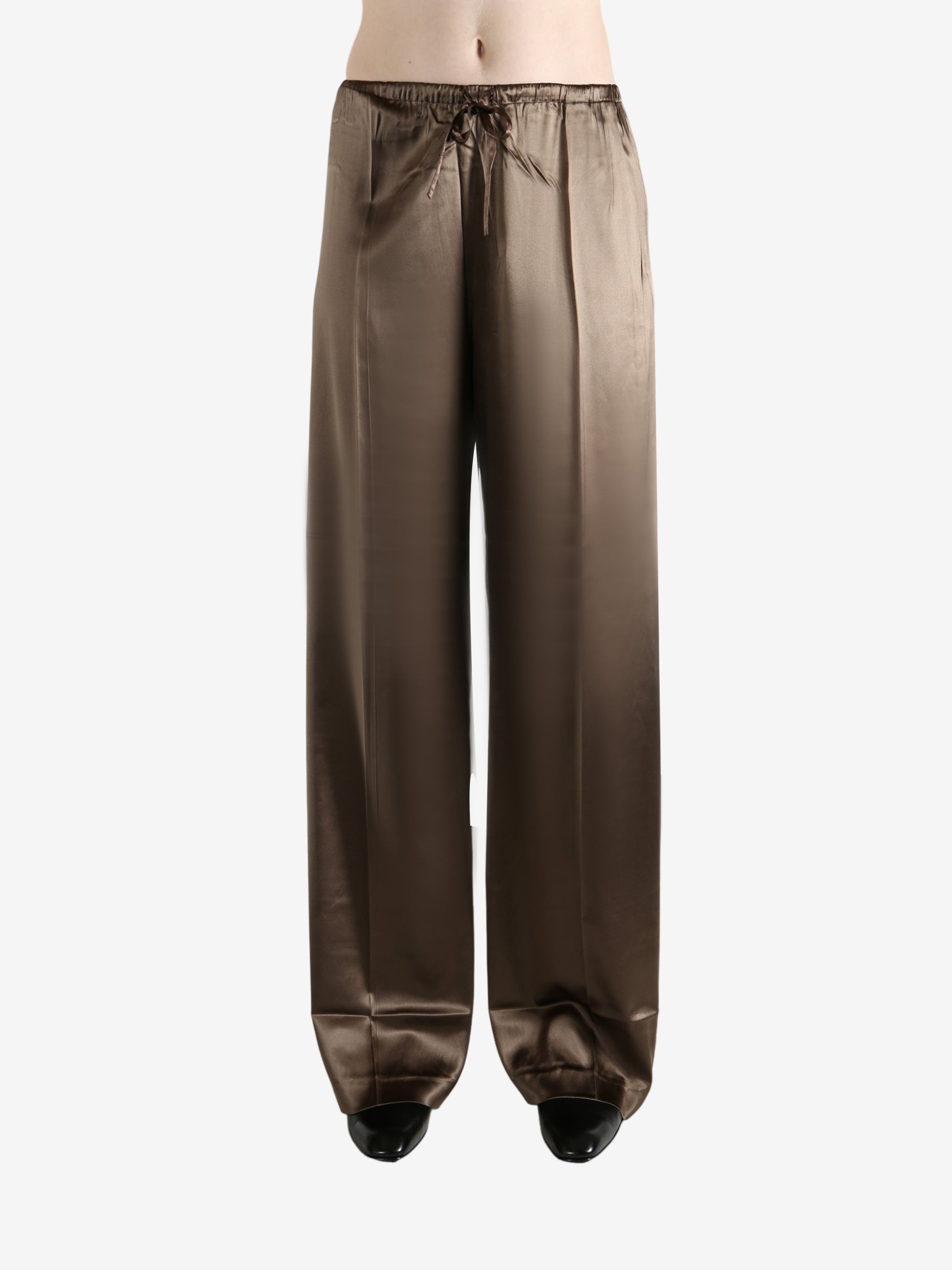 Brown pants worn by a person, showing the pants's fit