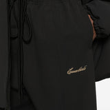 Close up of black pants, showing texture of the cotton fabric
