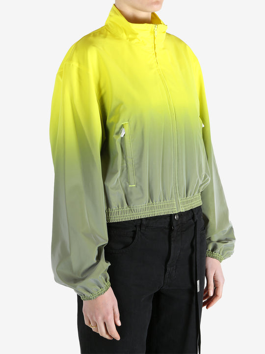 yellow jacket worn by a person, showing the jacket fit