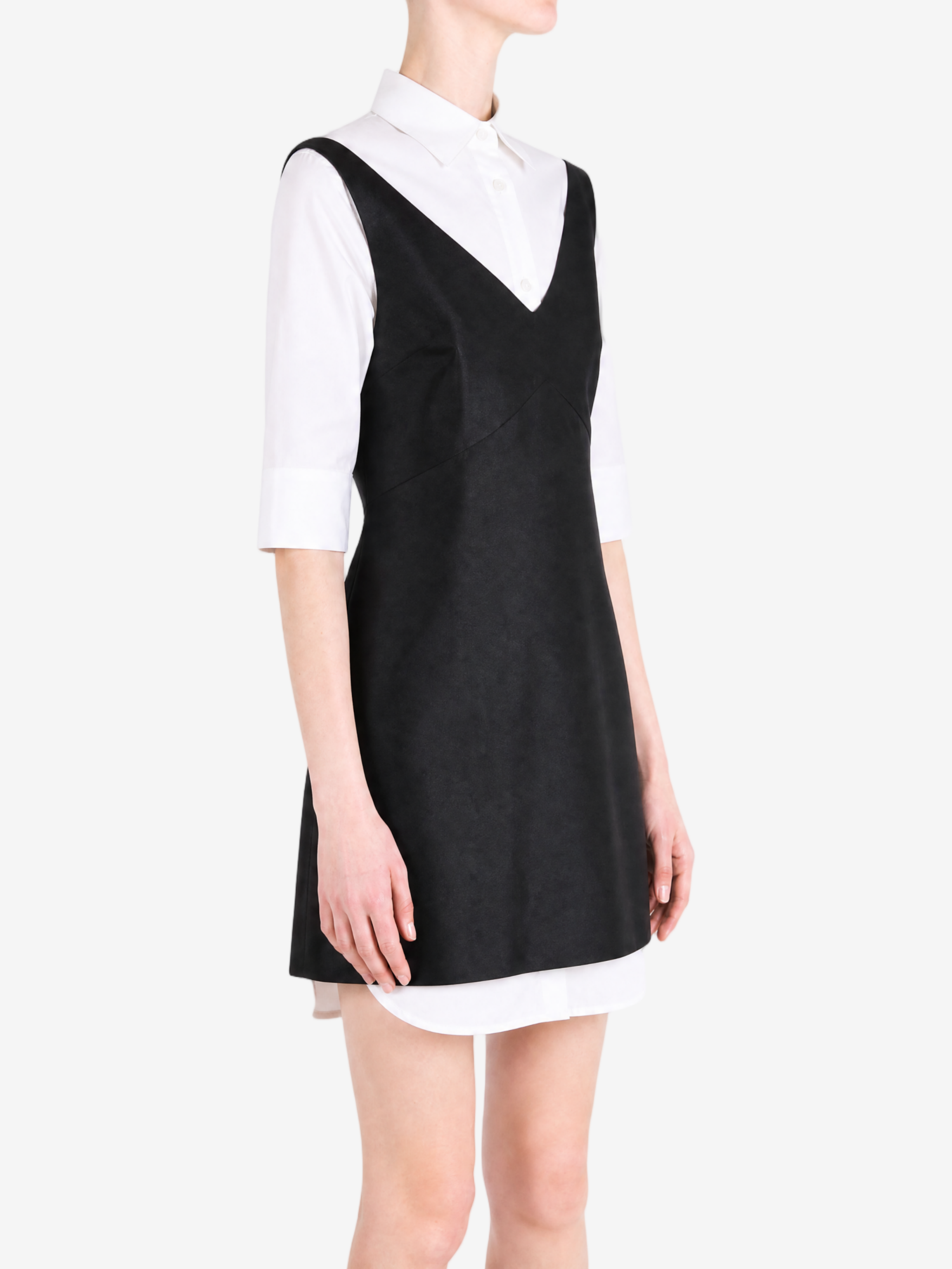 Black dress worn by a person, showing the dress fit