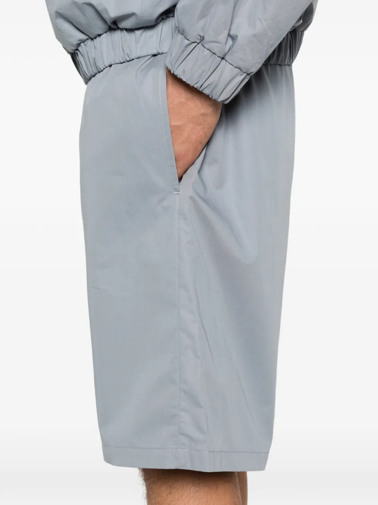 Close up of grey shorts, showing texture of the Cotton fabric