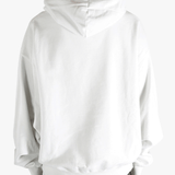 White sweat worn by a person, showing the sweat's fit