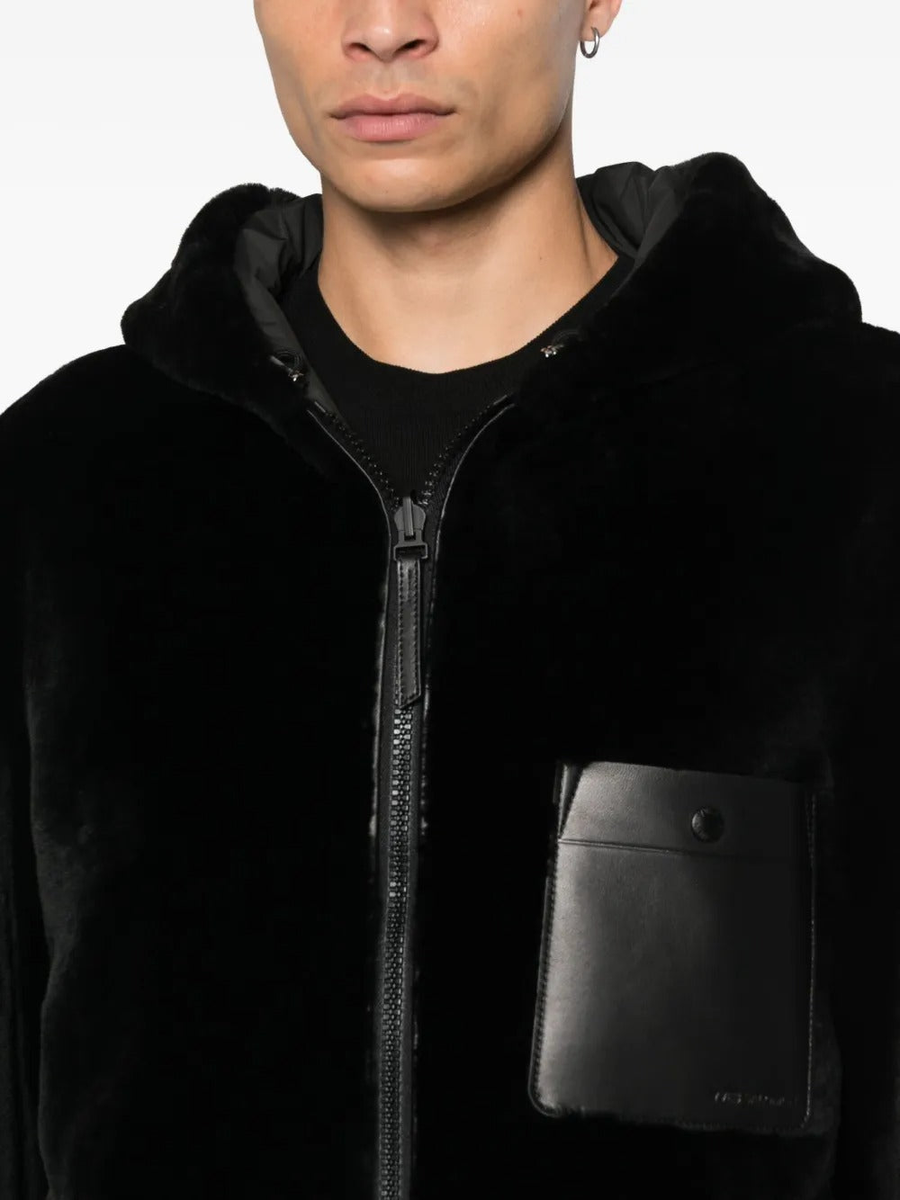 Close up of the black jacket, showing texture of the lamb fur fabric