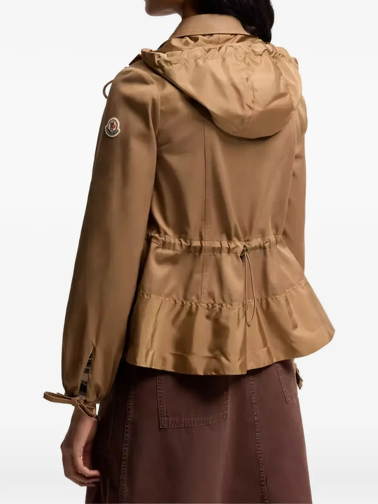 Brown jackets-coats worn by a person, showing the jackets-coats's fit