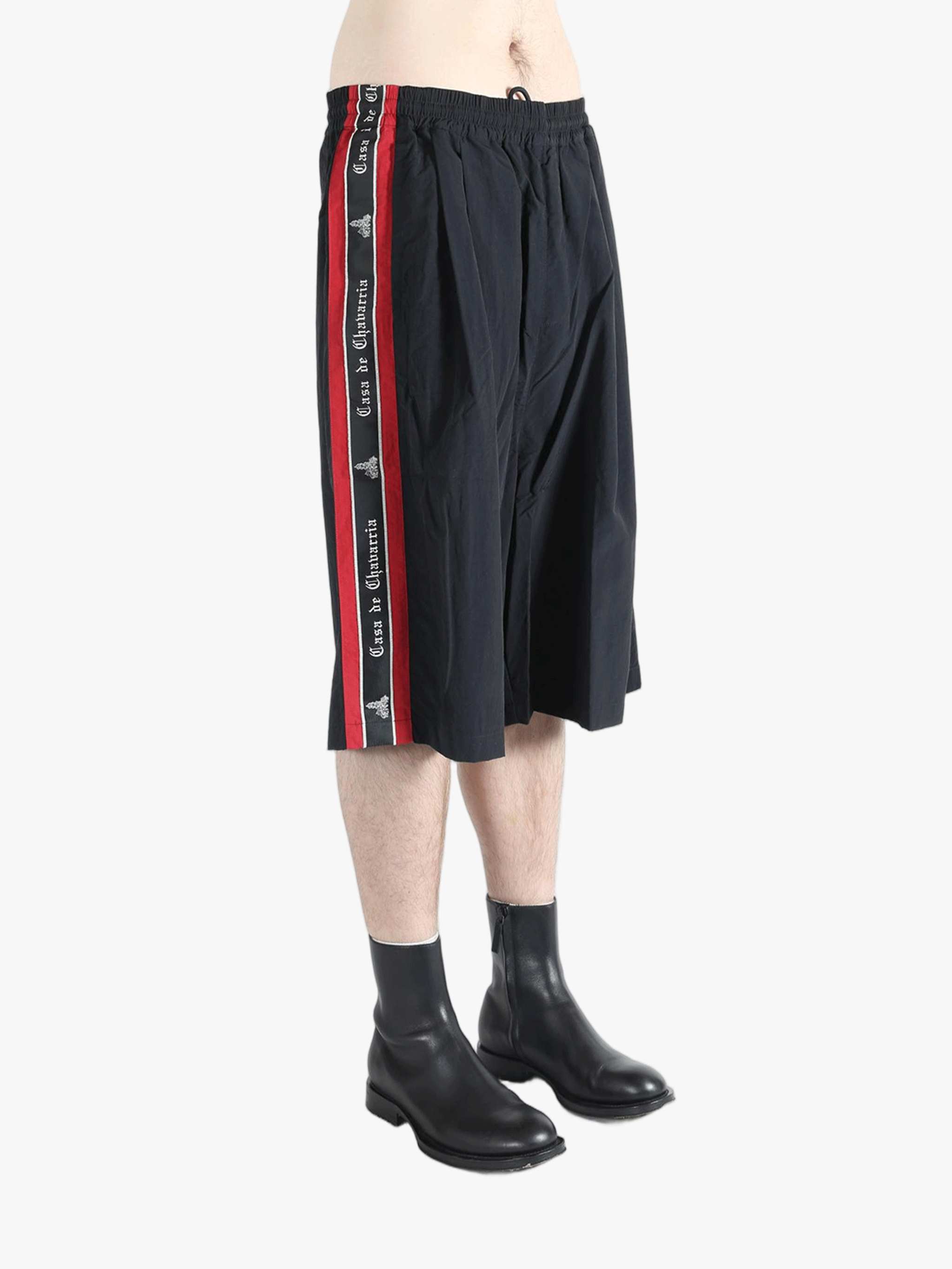 Black short worn by a person, showing the short's fit