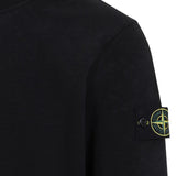 Close up of the black sweatshirt, showing texture of the cotton fabric