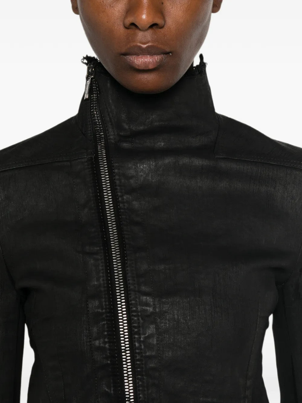 Black jacket worn by a person, showing the jacket fit