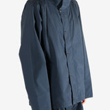 Navy jacket worn by a person, showing the jacket's fit