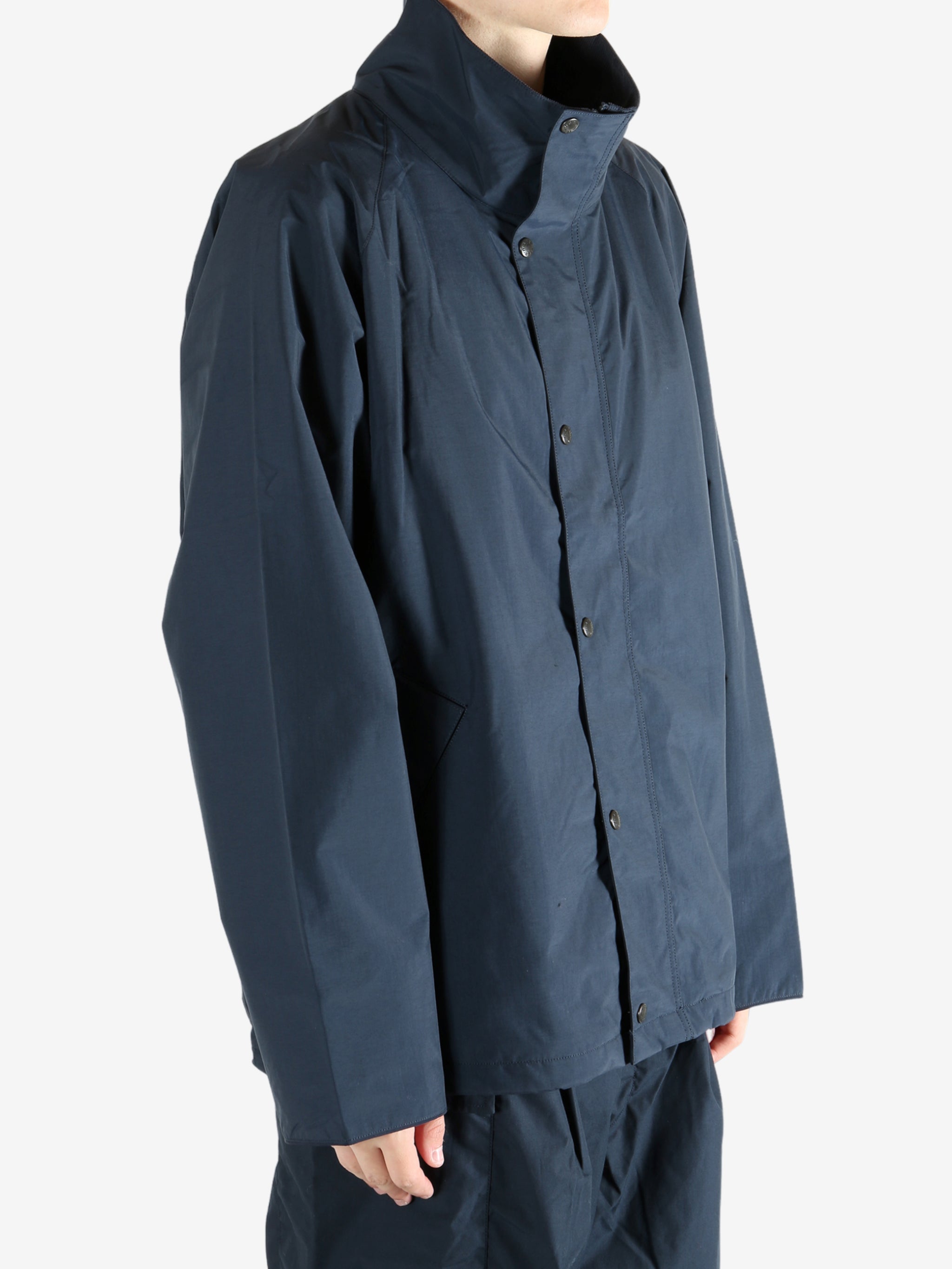 Navy jacket worn by a person, showing the jacket's fit