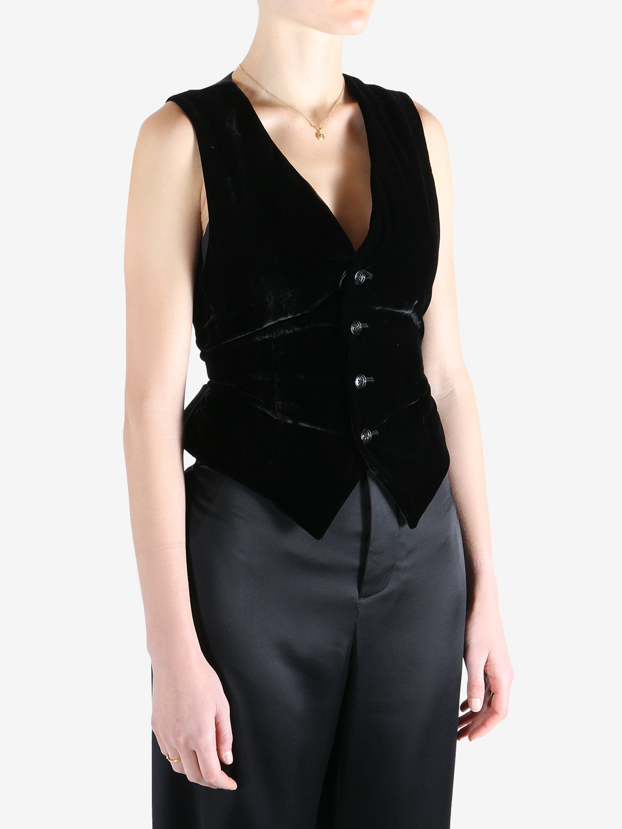 Black coat worn by a person, showing the coat's fit