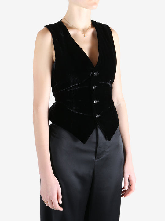 Black coat worn by a person, showing the coat's fit