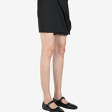 Black skirt worn by a person, showing the skirt's fit