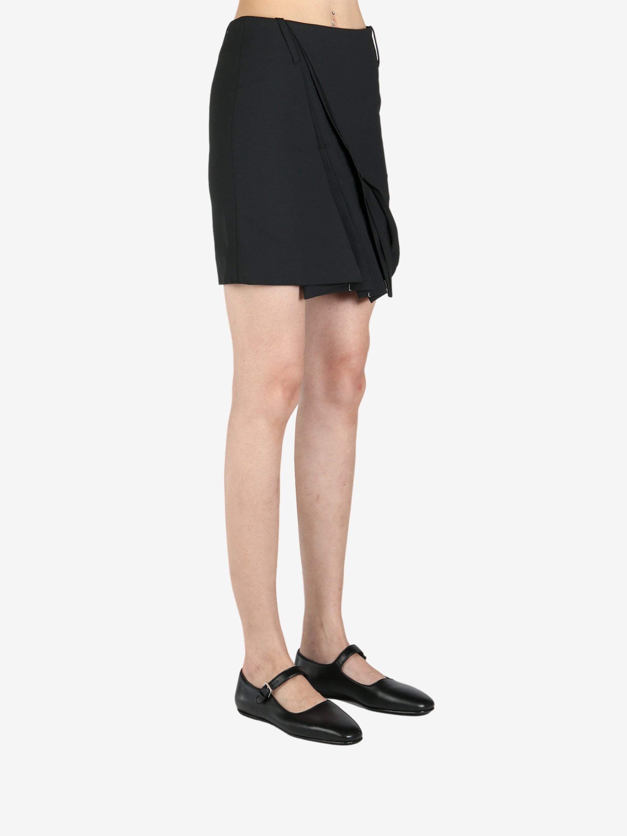 Black skirt worn by a person, showing the skirt's fit
