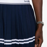 Close up of Navy dress, showing texture of the 94% polyester/ 6% elastane fabric