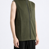 Green knitwear worn by a person, showing the knitwear fit