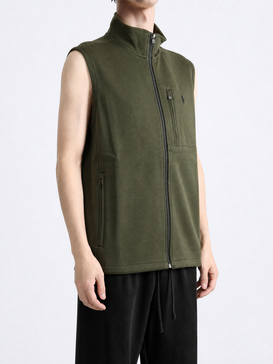 Green knitwear worn by a person, showing the knitwear fit