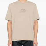 Tan t-shirt worn by a person, showing the tan t-shirt's fit
