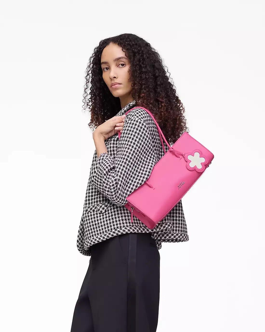 Pink bag worn by a person, showing the bag's fit