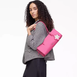 Pink bag worn by a person, showing the bag's fit