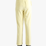 Yellow pants worn by a person, showing the pants' fit