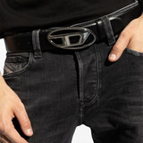 Black belt worn by a person, showing the belt fit