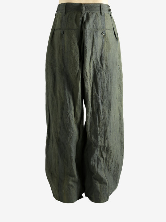 Green pants worn by a person, showing the pants' fit