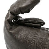 Close up of the black bag, showing texture of the leather fabric