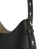 Close up of black bag, showing texture of the leather fabric